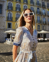 a lady wears a map printed midi dress